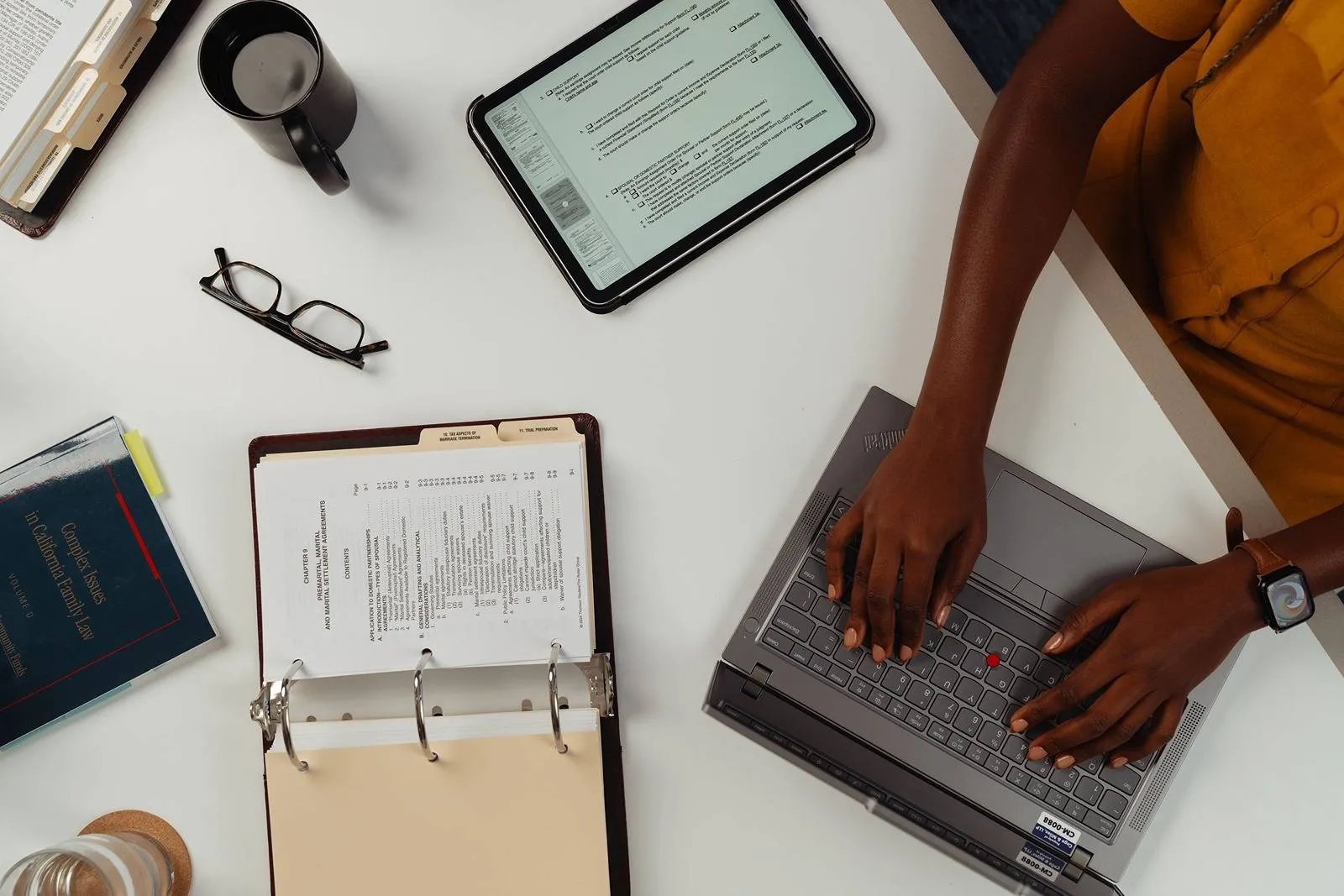 Cage & Miles LLP team member helping a client with family law documents