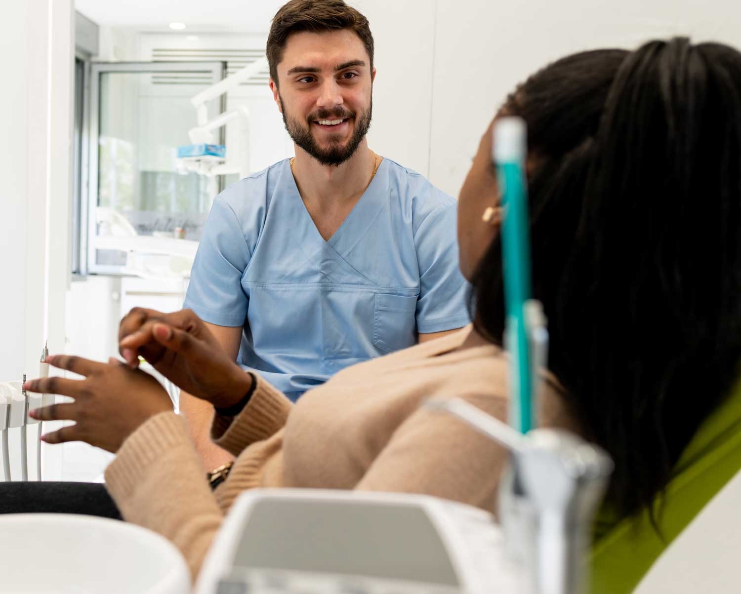 Dentist consulting with patient about treatment options