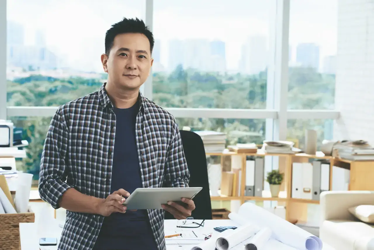 Singapore business owner reviewing marketing strategy