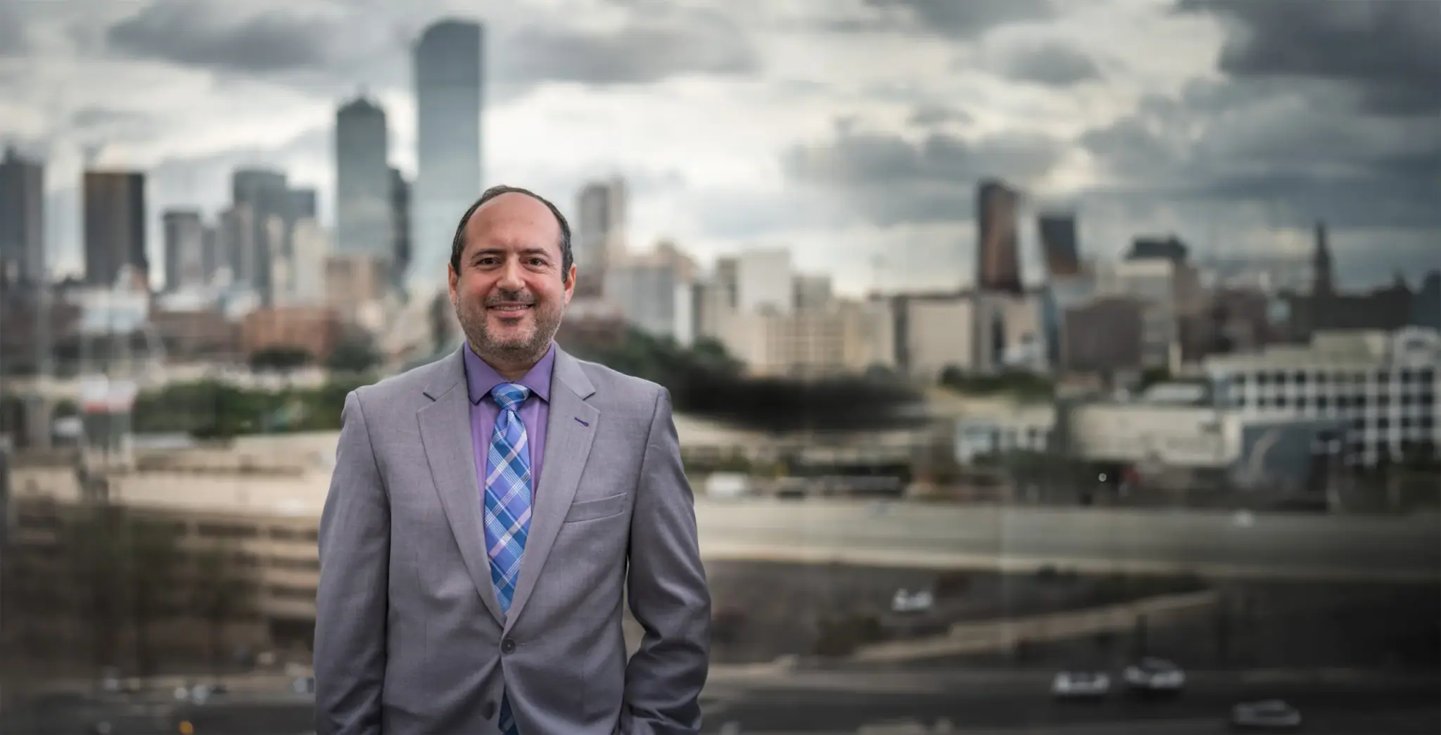Dallas criminal defense attorney Jim Spangler with the Dallas skyline