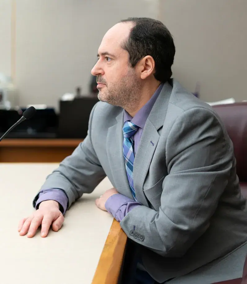 Dallas criminal defense attorney Jim Spangler seated at counsel table