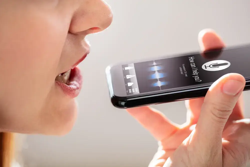 person using voice search through google