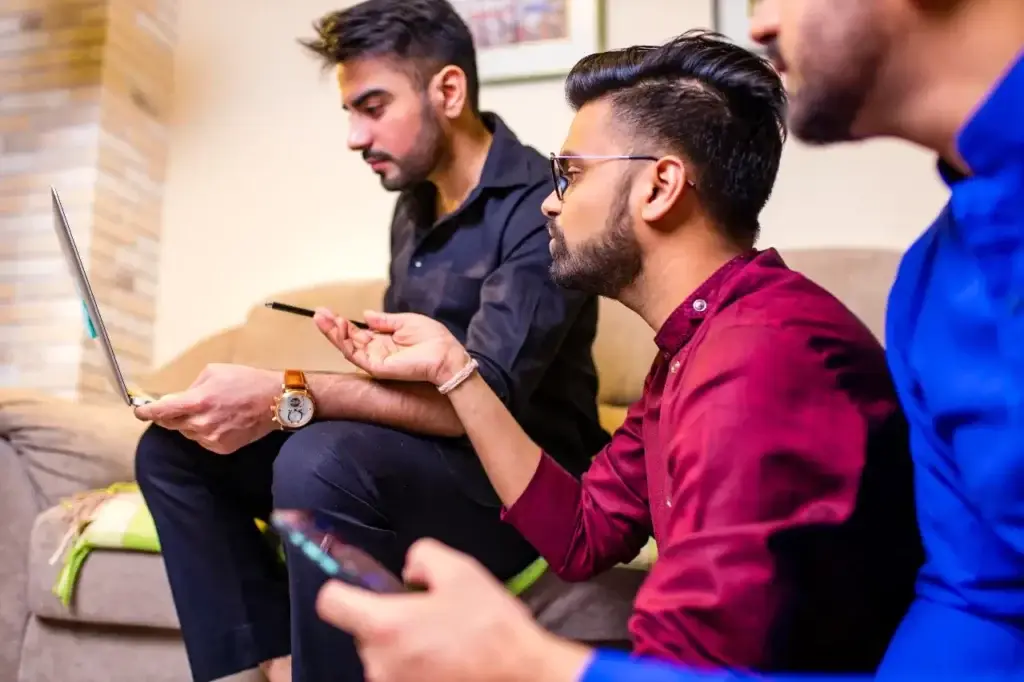 colleagues at a digital marketing agency discussing project details.